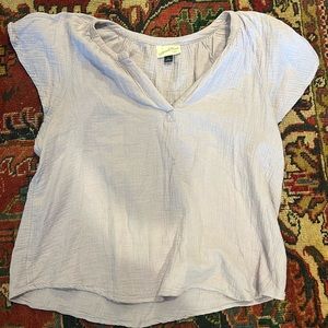 Light purple shirt.